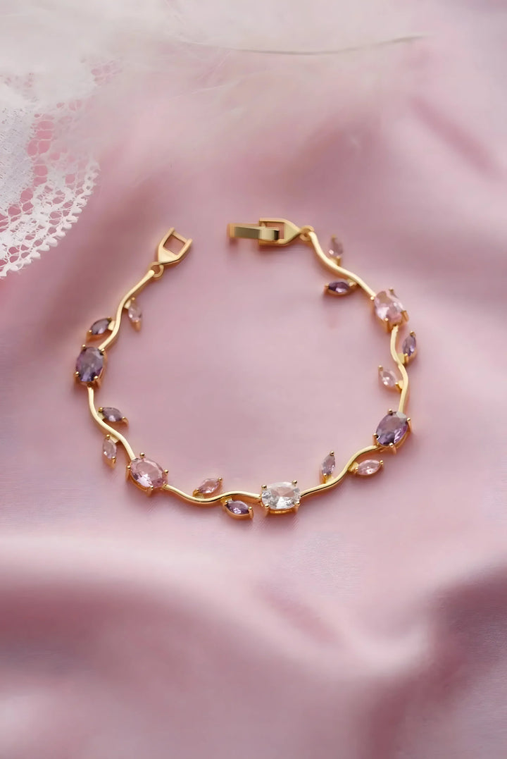 Gold bracelet with pink and clear gemstones, minimal vine design, elegant everyday jewelry