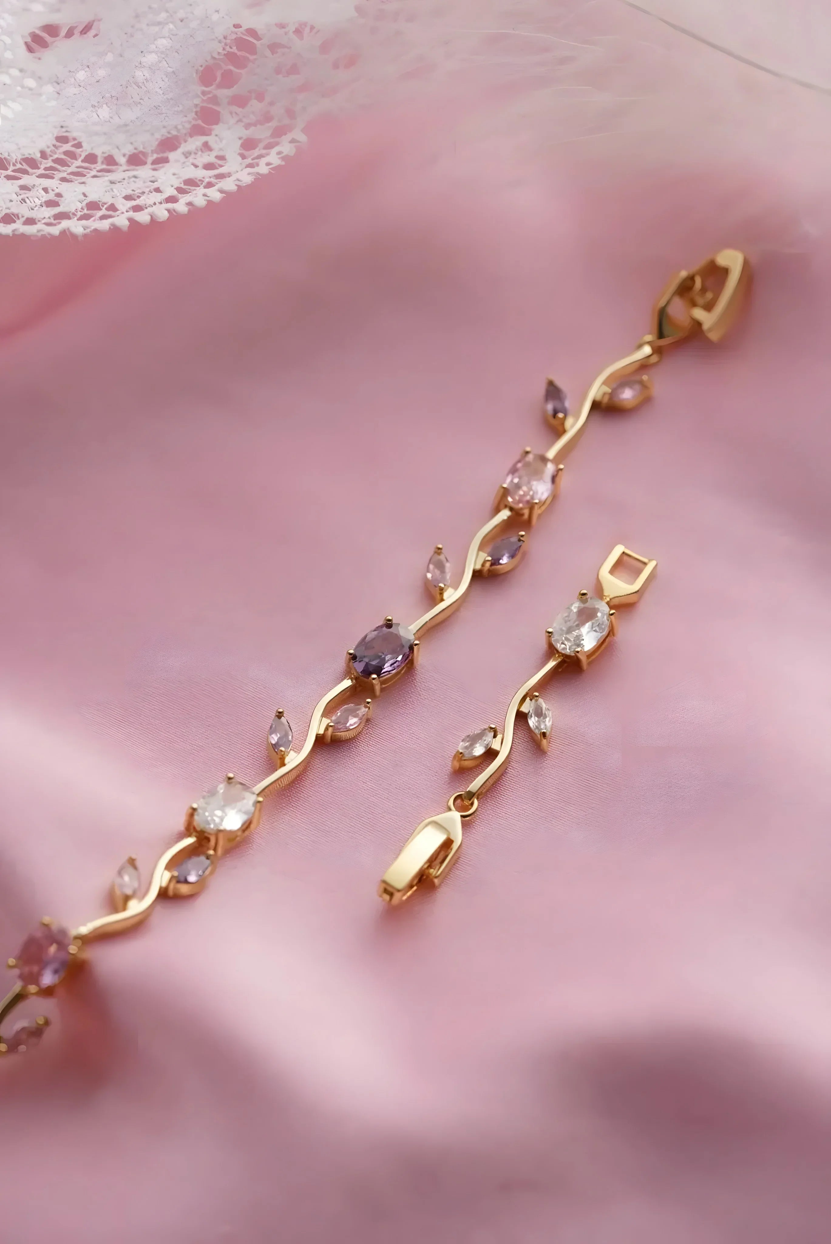 Gold vine-style bracelet with pink and clear gemstones, elegant everyday jewelry