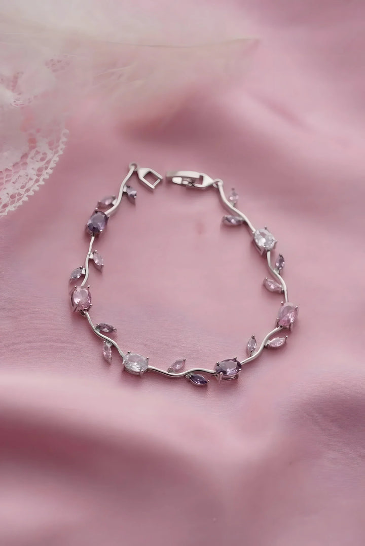 Elegant silver bracelet with pink and purple gemstones, minimal vine design for everyday wear