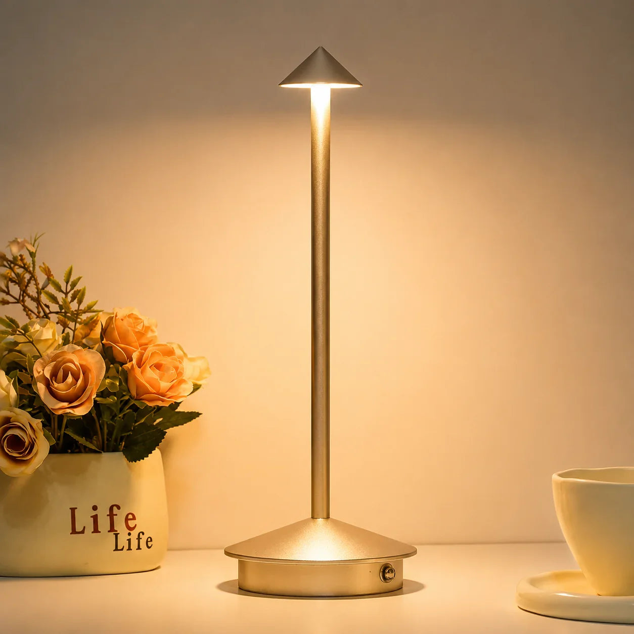 Modern gold table lamp with cone-shaped shade for bedroom or desk lighting