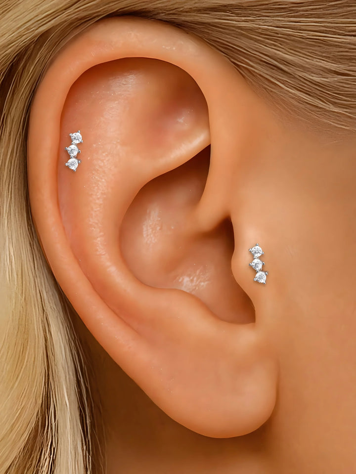 Zircon stud earrings, silver color, minimalist style, triple stone design on ear